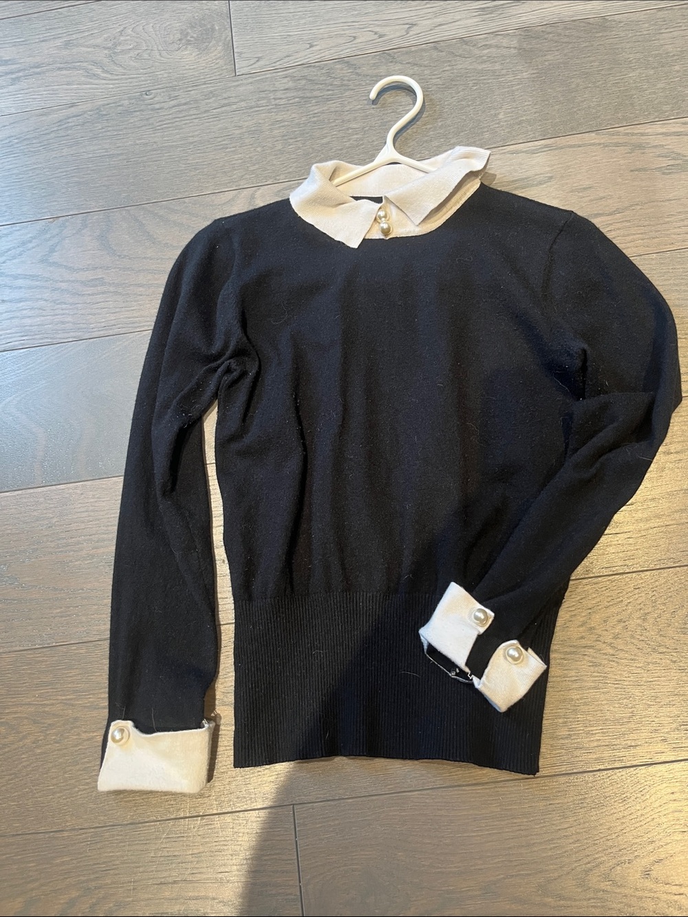 Classic Black Sweater with White Collar and Cuff Detail